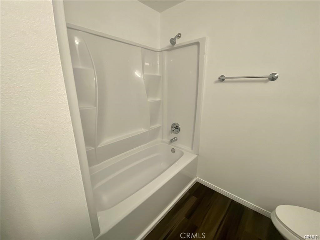 1101 West MacArthur Boulevard Santa Ana, CA 92707 - Photo 4 of 16 a bathroom with a bathtub and a shower