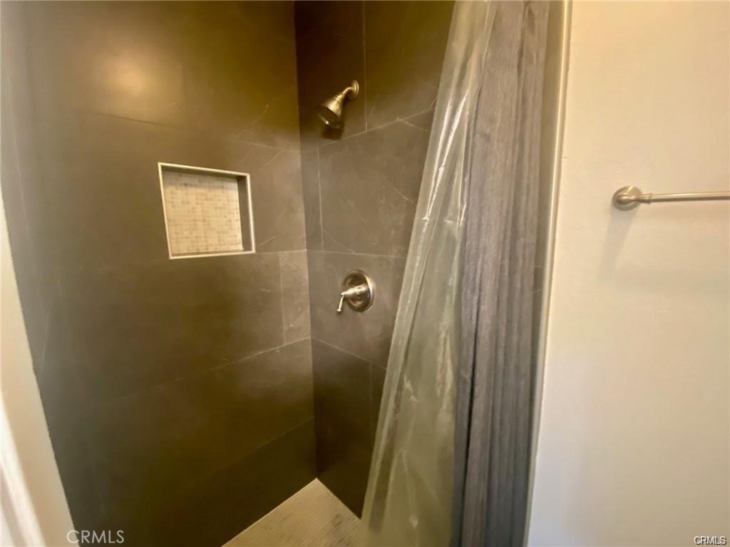 1101 West MacArthur Boulevard Santa Ana, CA 92707 - Photo 7 of 16 a bathroom with a shower