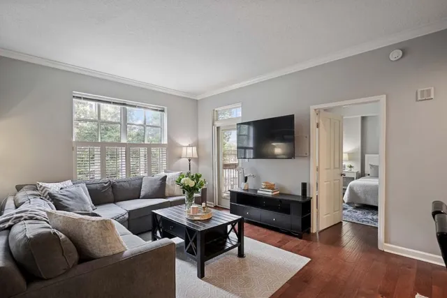a living room with furniture kitchen view and a dining table