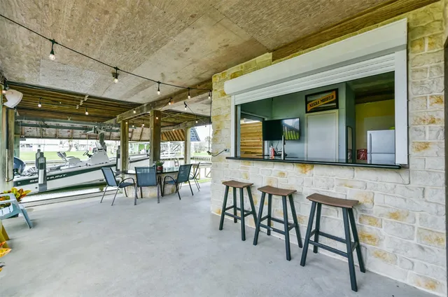 a view of a lobby with furniture and a window
