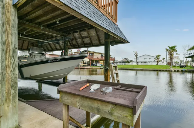 a view of a chairs and table on the deck