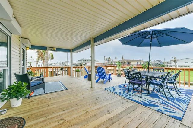 an outdoor space with furniture and umbrella