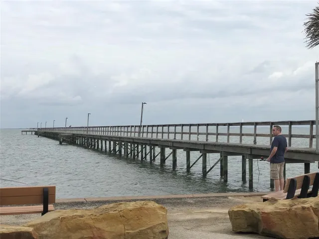 a view of swimming pool with seating area