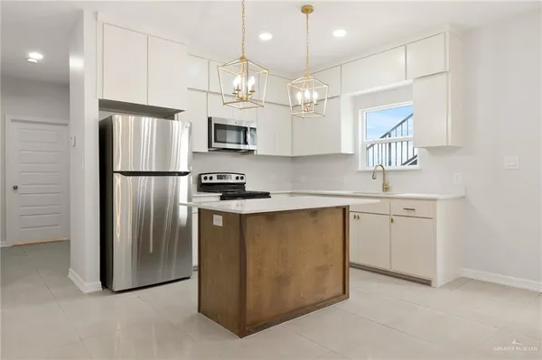 an empty room with a window and a ceiling fan