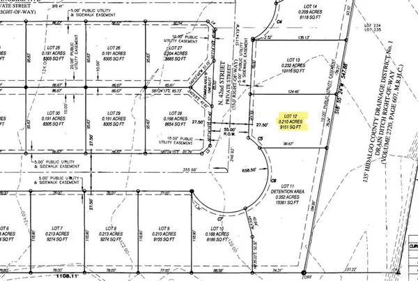 an aerial view of a house with a garden and plants