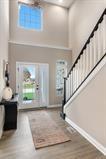 8670 Burr Rdg Circle Crown Point, IN 46307 - Photo 22 of 36 a view of entryway and hall with wooden floor