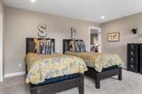 8670 Burr Rdg Circle Crown Point, IN 46307 - Photo 26 of 36 a bed sitting in a bedroom and table