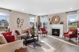 8670 Burr Rdg Circle Crown Point, IN 46307 - Photo 28 of 36 a living room with furniture and a fireplace