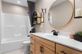 8670 Burr Rdg Circle Crown Point, IN 46307 - Photo 32 of 36 a bathroom with a sink a toilet and tub