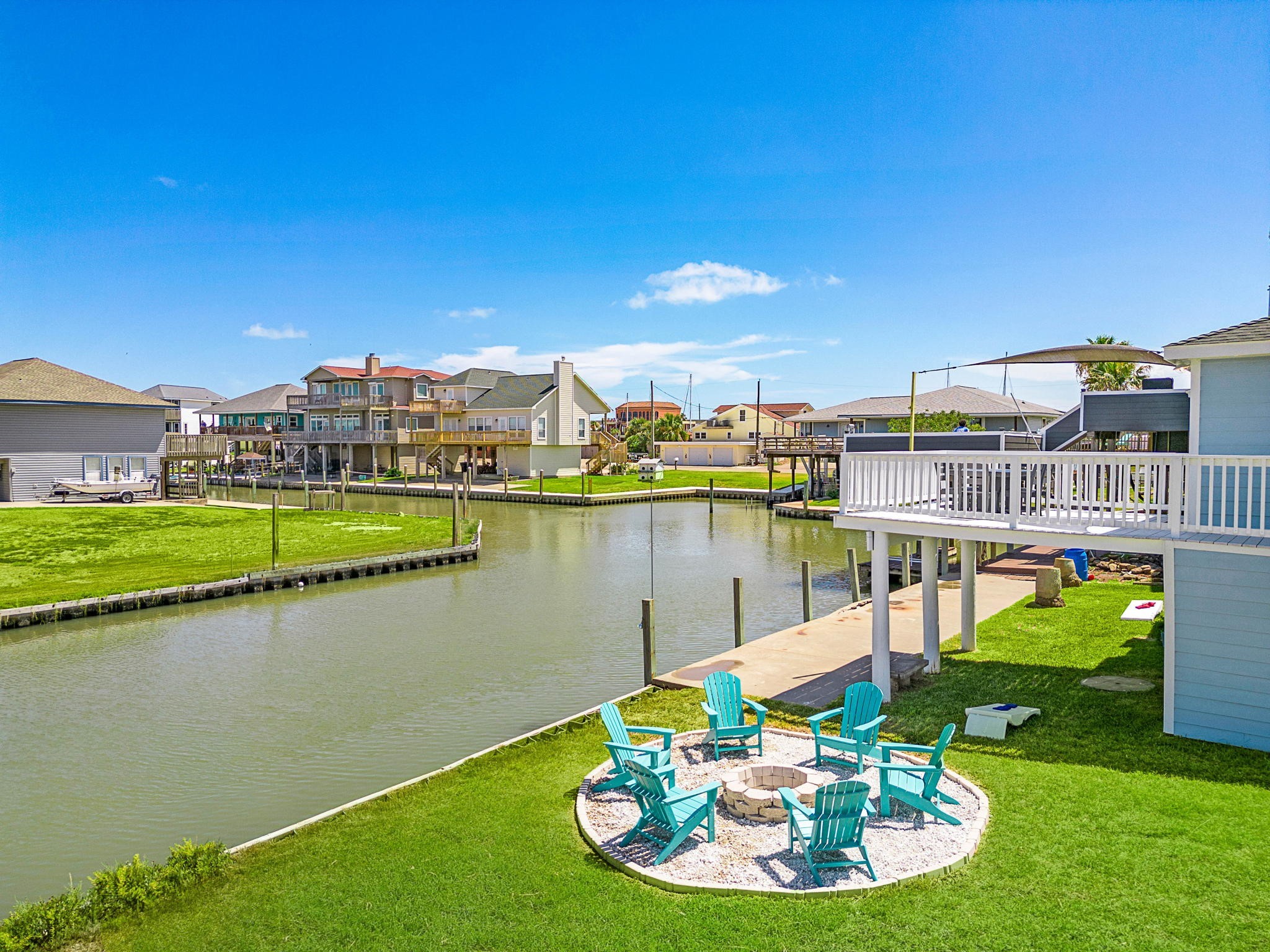 104 Marlin Avenue Freeport, TX 77541 - Photo 2 of 43 a view of a lake with a house swimming pool and outdoor space