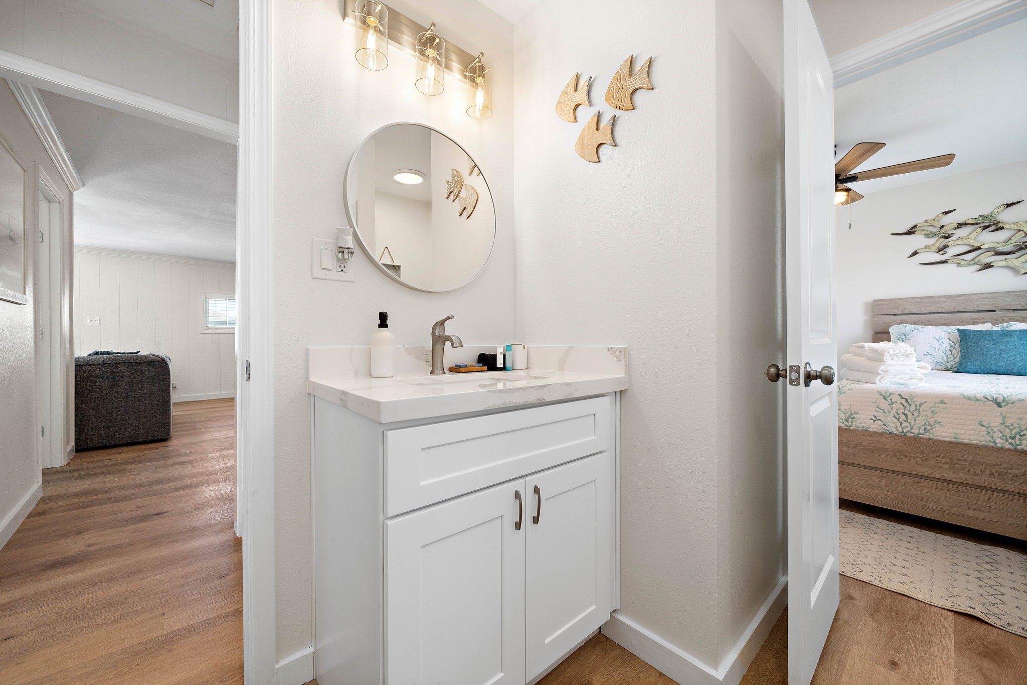 104 Marlin Avenue Freeport, TX 77541 - Photo 23 of 43 a en suite bathroom with a sink and a mirror
