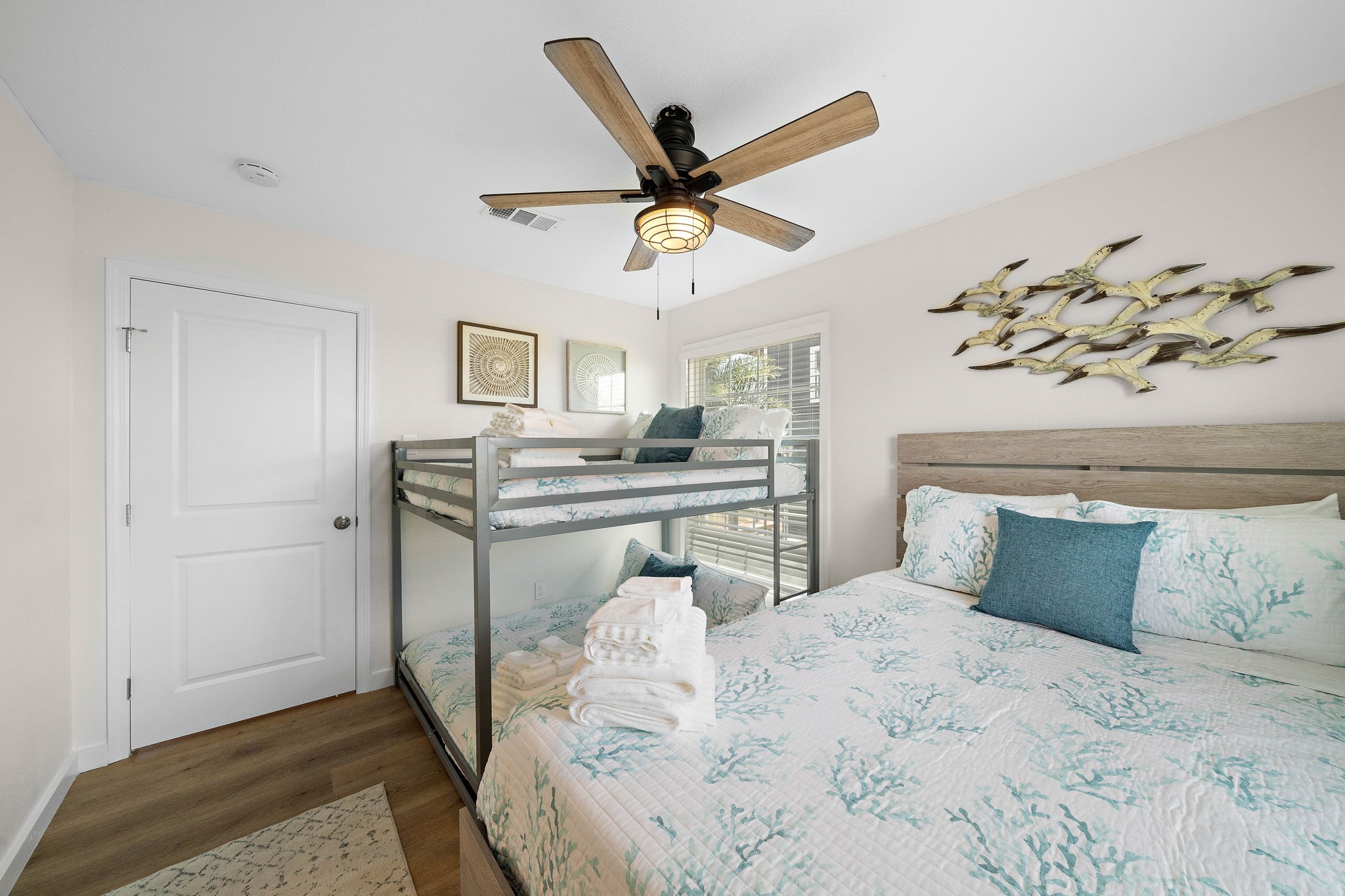 104 Marlin Avenue Freeport, TX 77541 - Photo 26 of 43 a bedroom with a bed and a chandelier