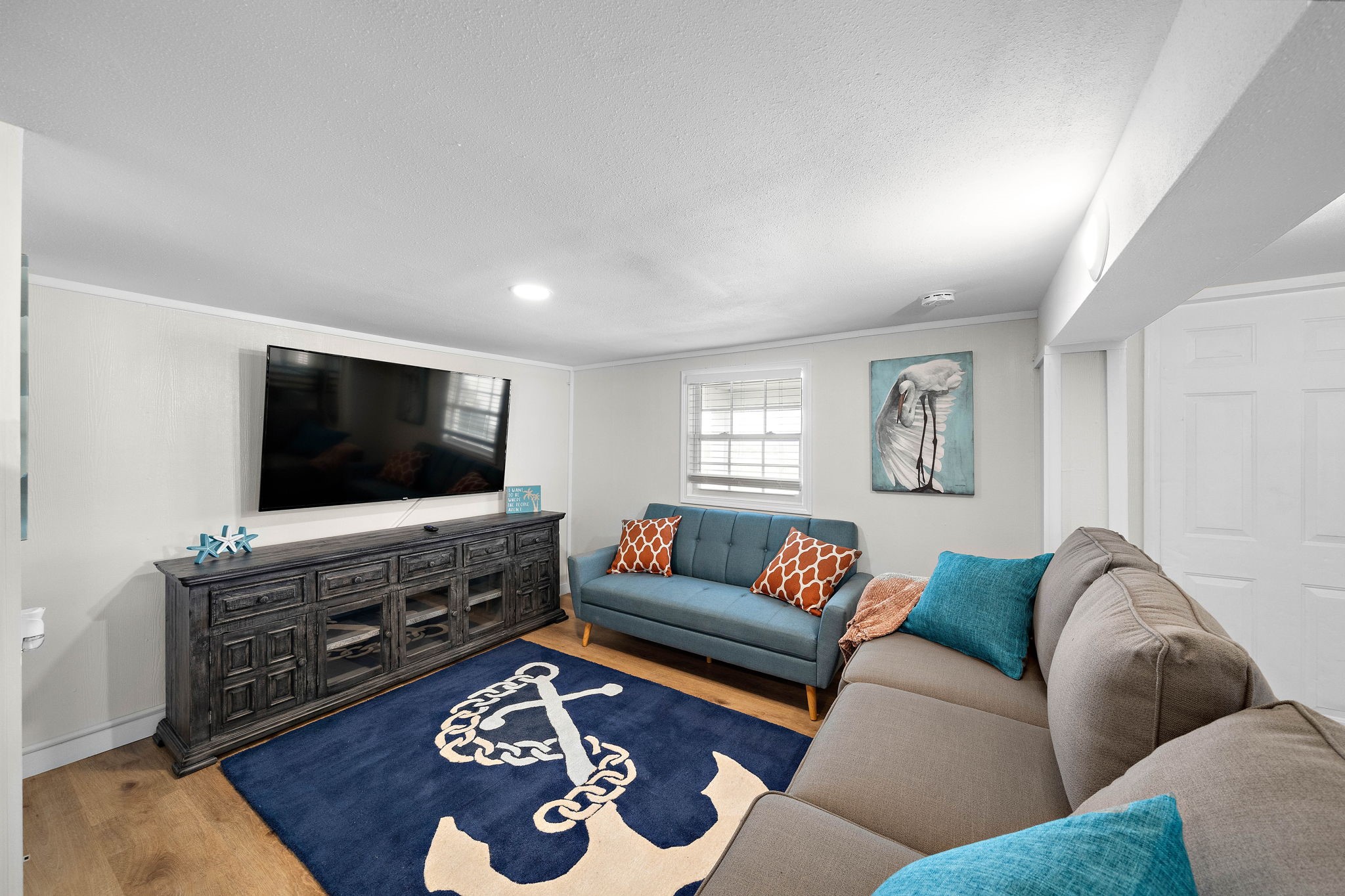 104 Marlin Avenue Freeport, TX 77541 - Photo 32 of 43 a living room with furniture and a flat screen tv