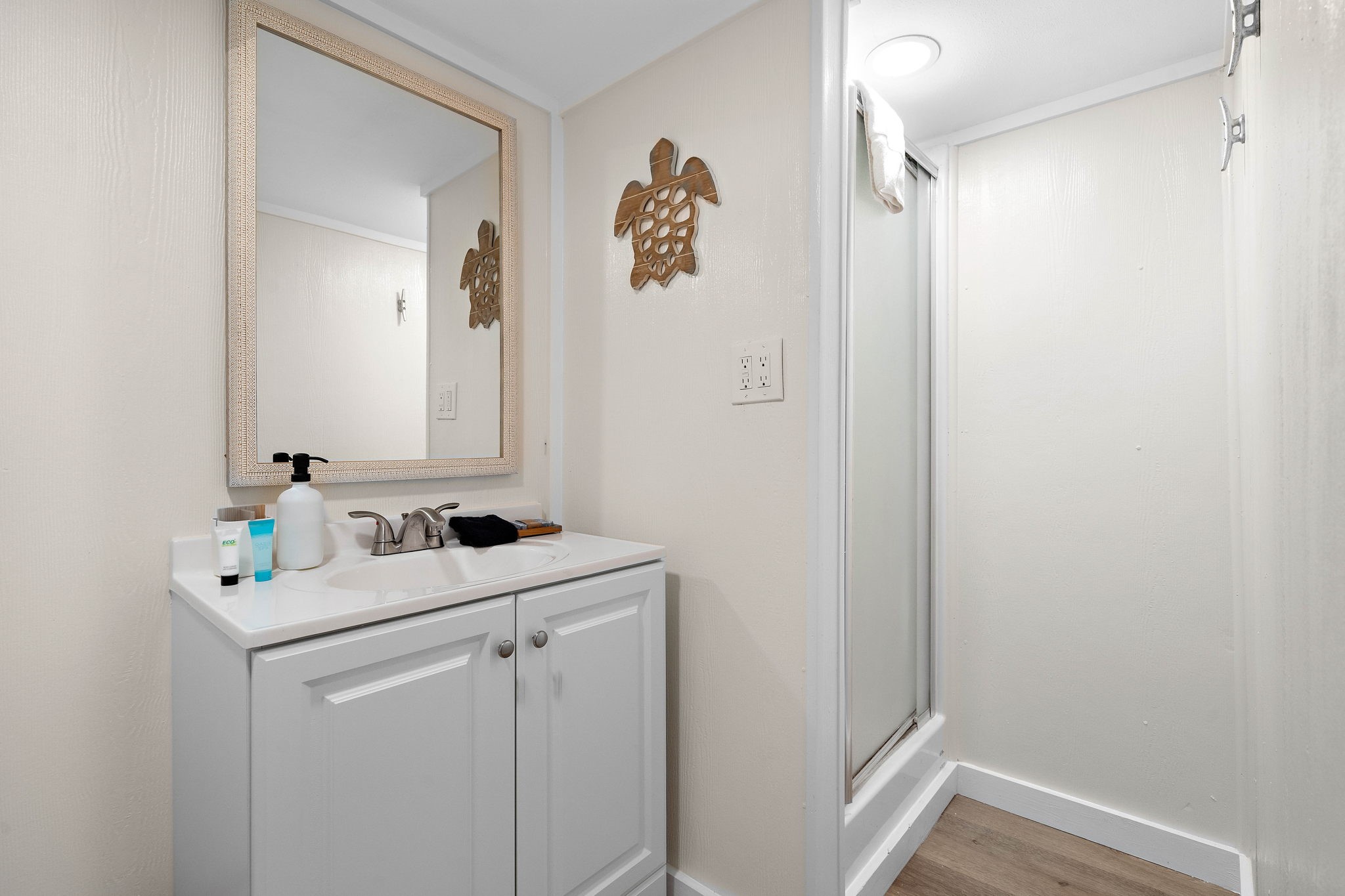 104 Marlin Avenue Freeport, TX 77541 - Photo 39 of 43 a bathroom with a sink a vanity and a mirror