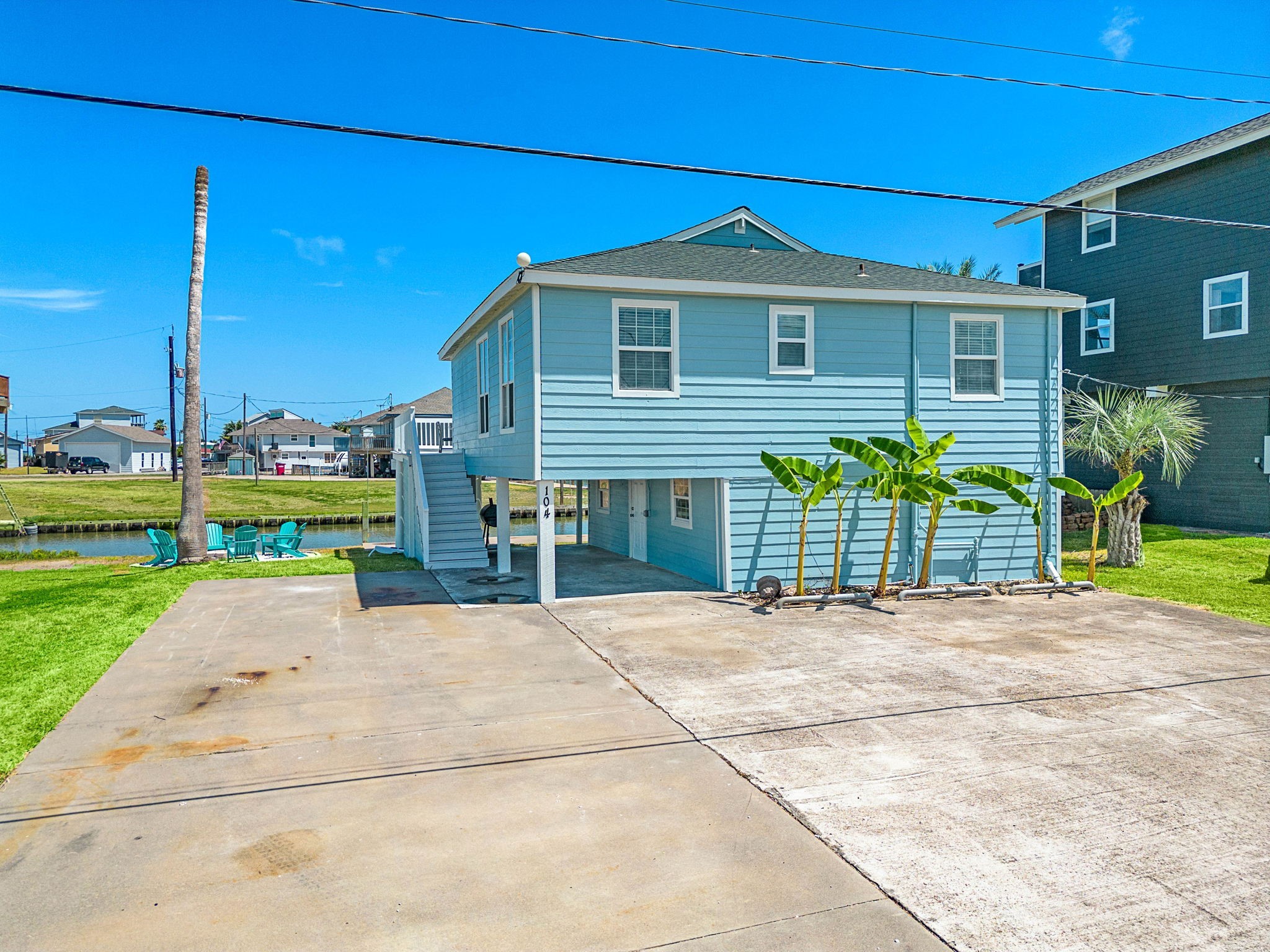 104 Marlin Avenue Freeport, TX 77541 - Photo 5 of 43 a house with a yard and potted plants
