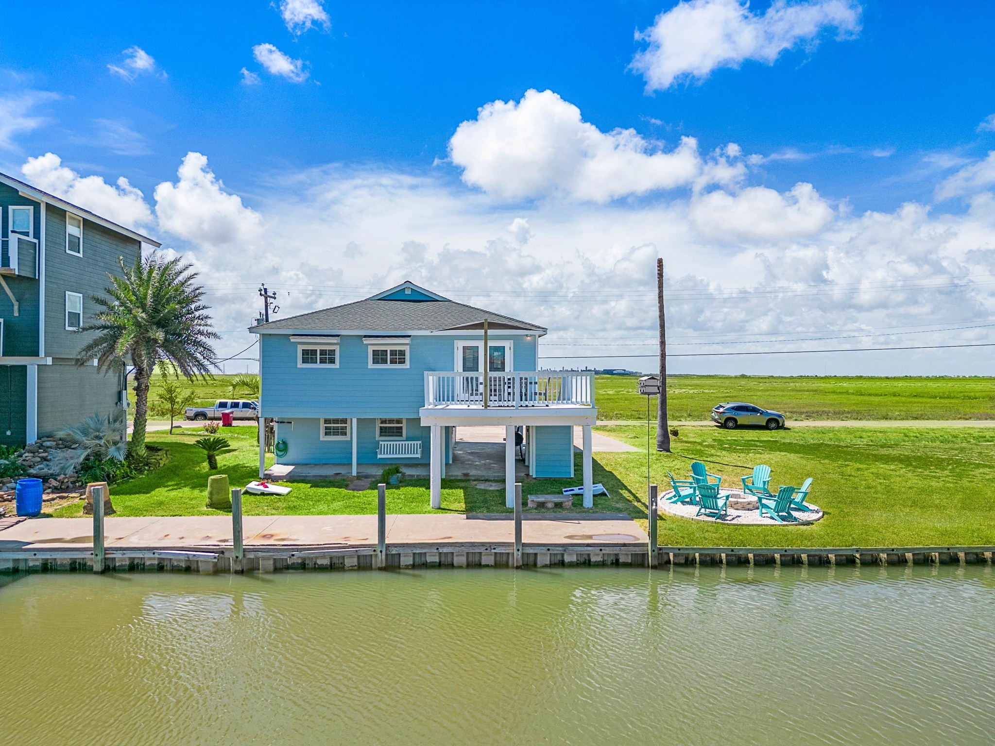 104 Marlin Avenue Freeport, TX 77541 - Photo 6 of 43 a view of a lake with a building in the background