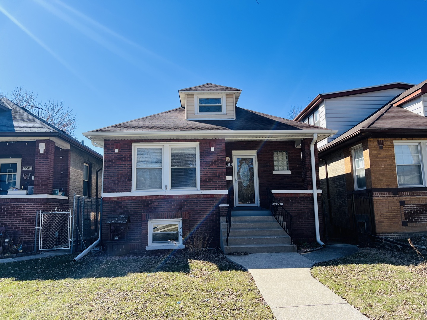 3516 North Keating Avenue, Unit G Chicago, IL 60641 - Photo 1 of 20 a front view of a house with a yard