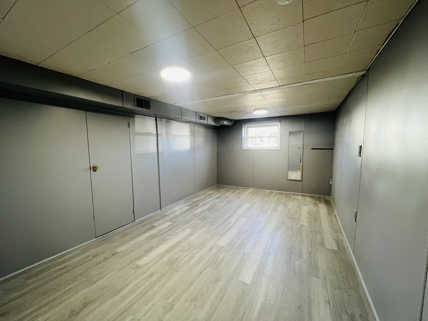 3516 North Keating Avenue, Unit G Chicago, IL 60641 - Photo 11 of 20 a view of empty room with wooden floor