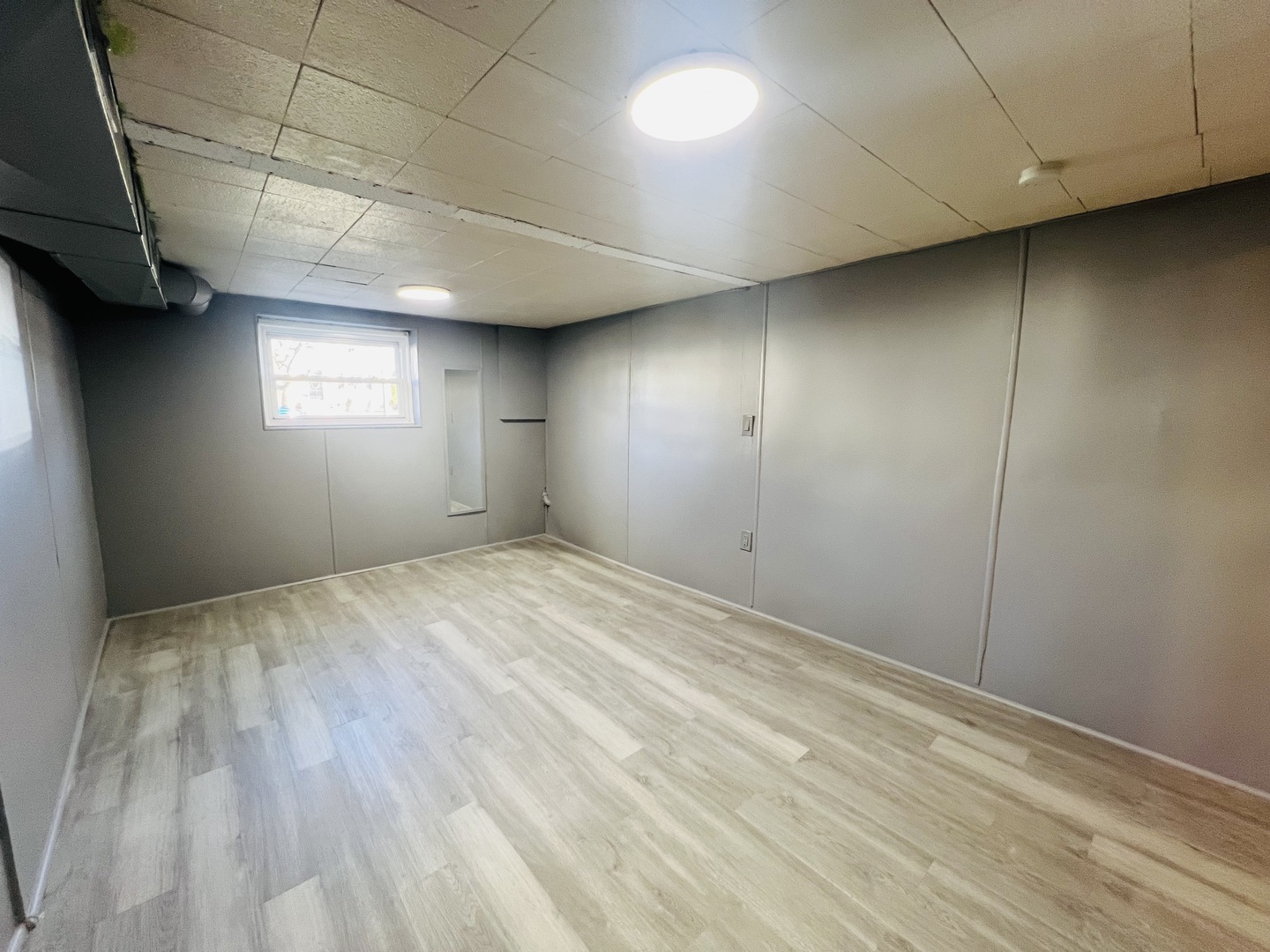3516 North Keating Avenue, Unit G Chicago, IL 60641 - Photo 13 of 20 an empty room with windows