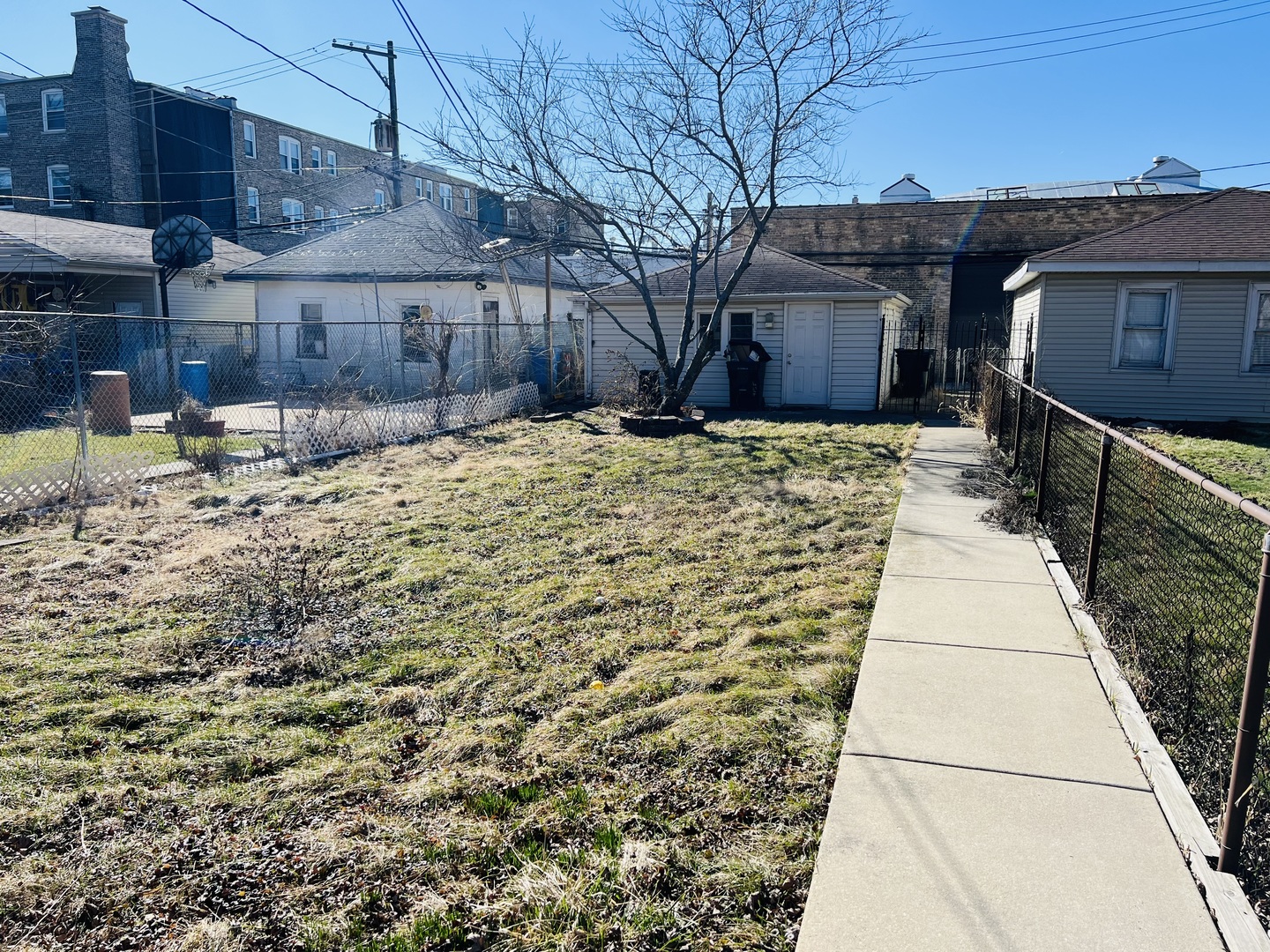 3516 North Keating Avenue, Unit G Chicago, IL 60641 - Photo 20 of 20 a front view of a house with a yard