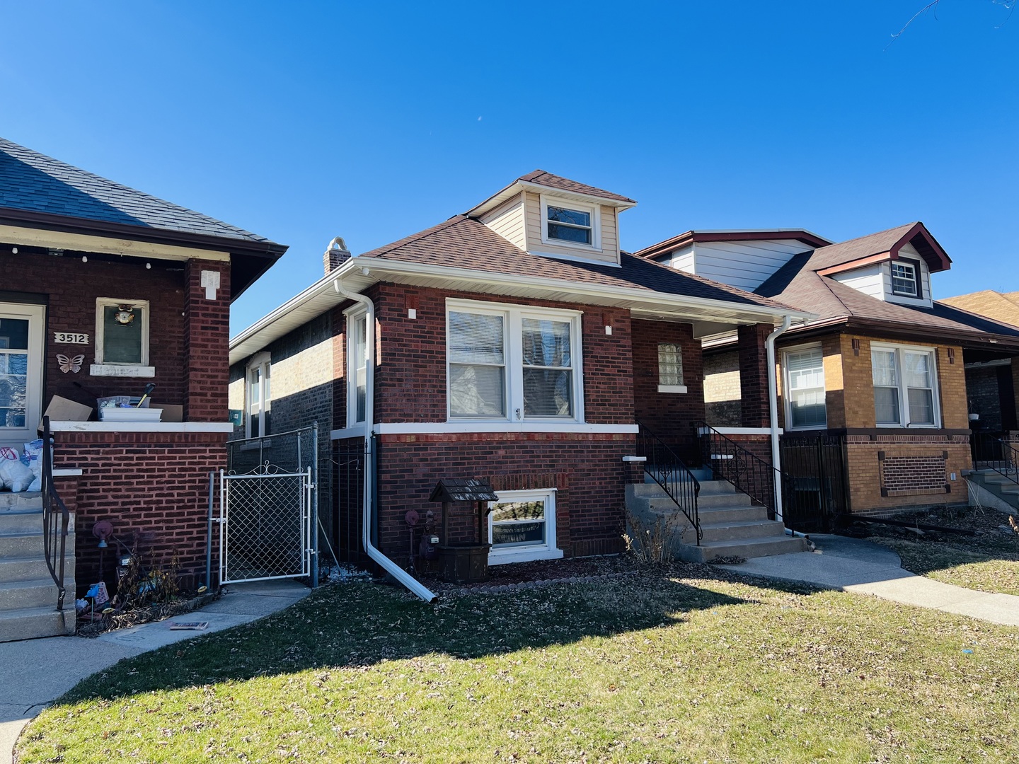 3516 North Keating Avenue, Unit G Chicago, IL 60641 - Photo 2 of 20 a front view of a house with a yard