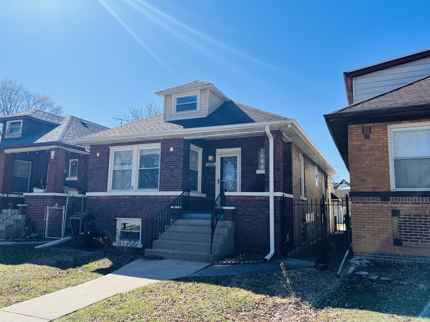 3516 North Keating Avenue, Unit G Chicago, IL 60641 - Photo 3 of 20 a front view of a house with a yard