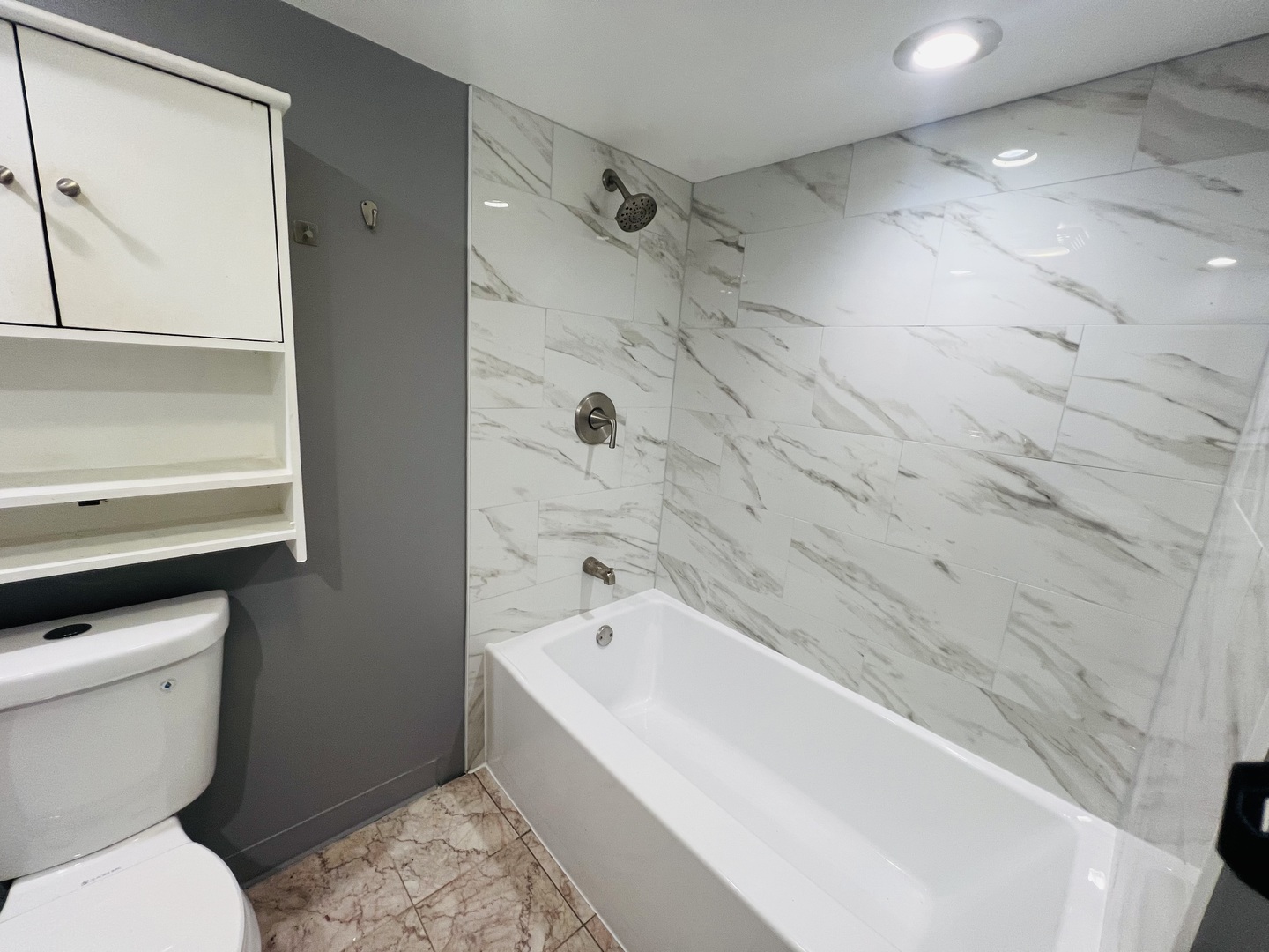 3516 North Keating Avenue, Unit G Chicago, IL 60641 - Photo 5 of 20 a bathroom with a toilet and a bathtub