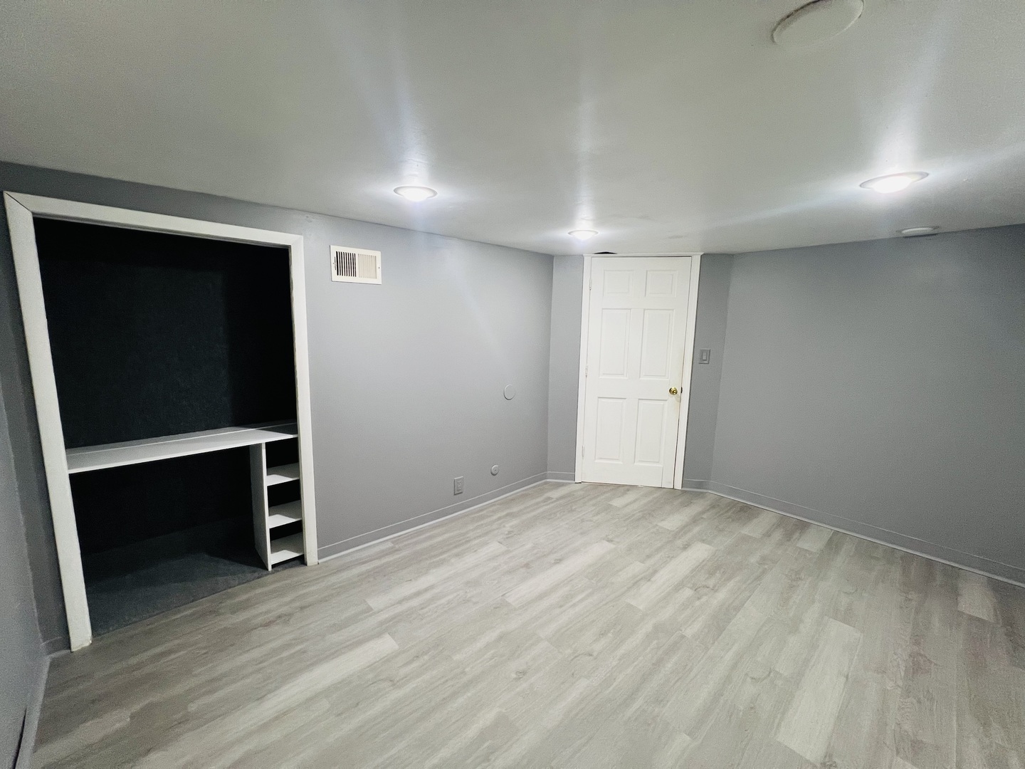 3516 North Keating Avenue, Unit G Chicago, IL 60641 - Photo 7 of 20 an empty room with wooden floor and closet