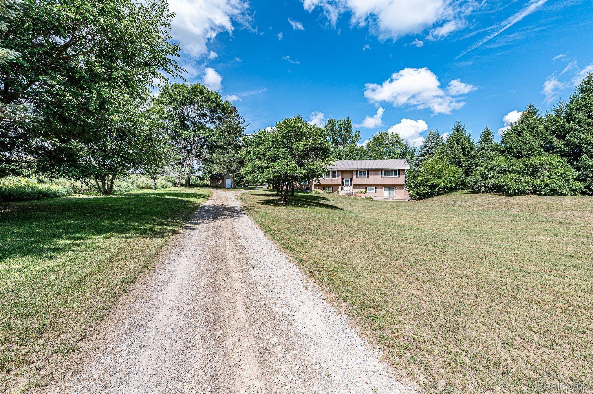 7881 Oak Grove Road Howell, MI 48855 - Photo 16 of 31 Exterior view from end of driveway.jpeg