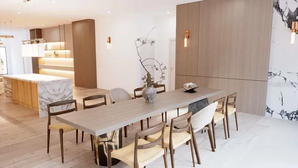 a view of a dining room with furniture and wooden floor