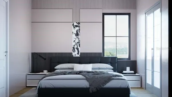 a bedroom with a bed and a window