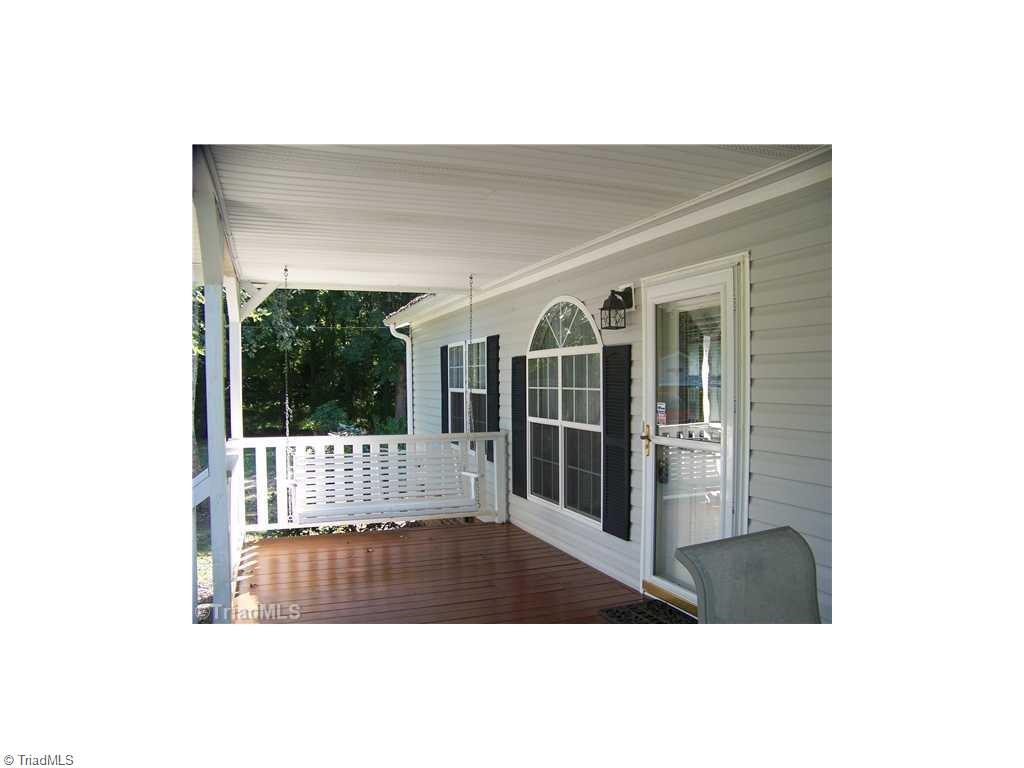 1137 Thayer Road Trinity, NC 27370 - Photo 3 of 14 Enjoy the swing or just play cards on this covered porch after a long day