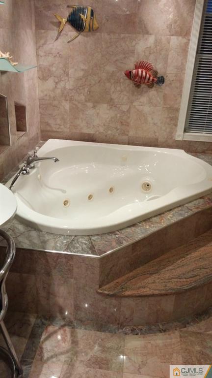 37 Rainford Road Edison, NJ 08820 - Photo 11 of 18 a bathroom with a granite countertop