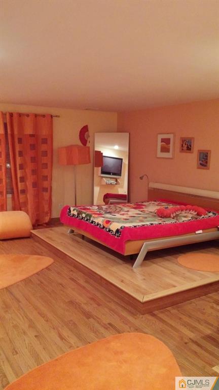 37 Rainford Road Edison, NJ 08820 - Photo 14 of 18 a bedroom with a bed and a book shelf