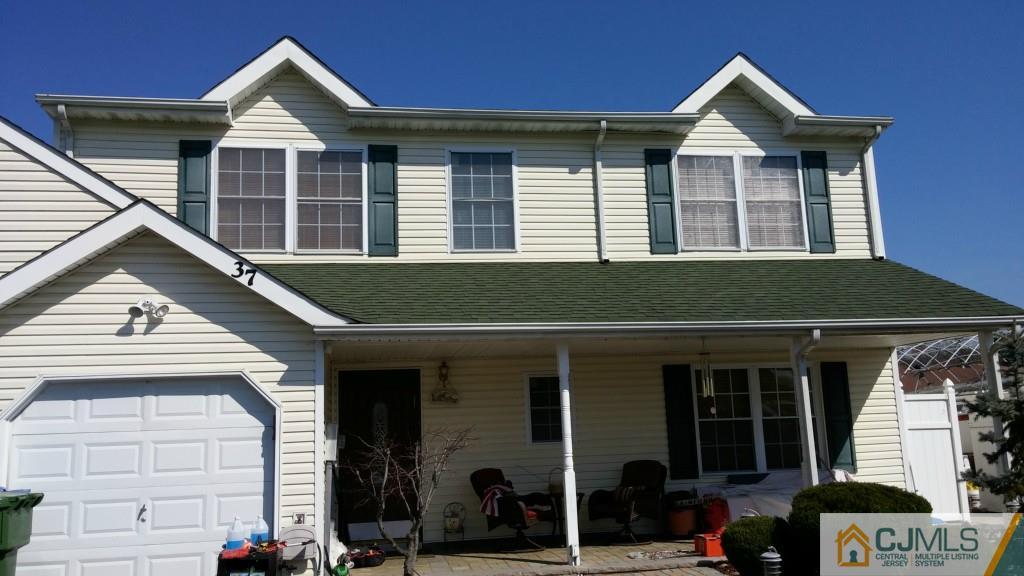 37 Rainford Road Edison, NJ 08820 - Photo 17 of 18 a front view of a house with a yard and garage