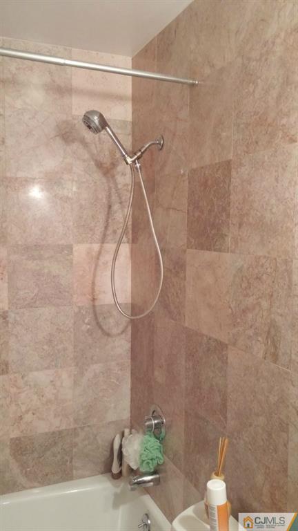 37 Rainford Road Edison, NJ 08820 - Photo 3 of 18 a bathroom with a shower