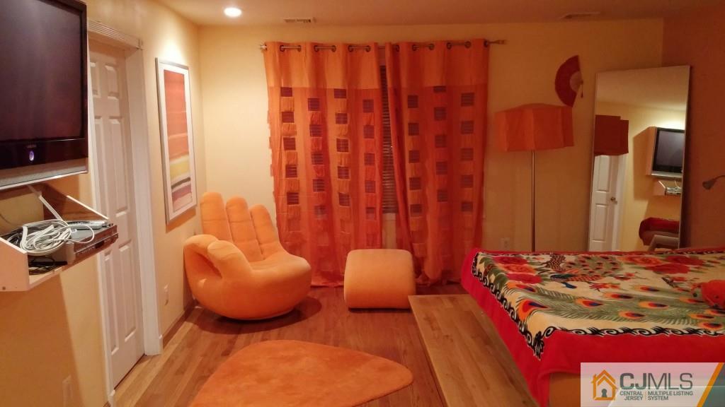 37 Rainford Road Edison, NJ 08820 - Photo 7 of 18 a bedroom with furniture and a mirror