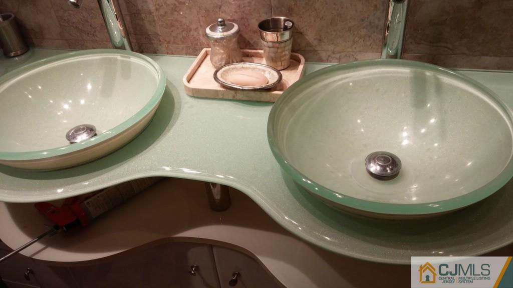 37 Rainford Road Edison, NJ 08820 - Photo 9 of 18 a bathroom with a sink and a mirror