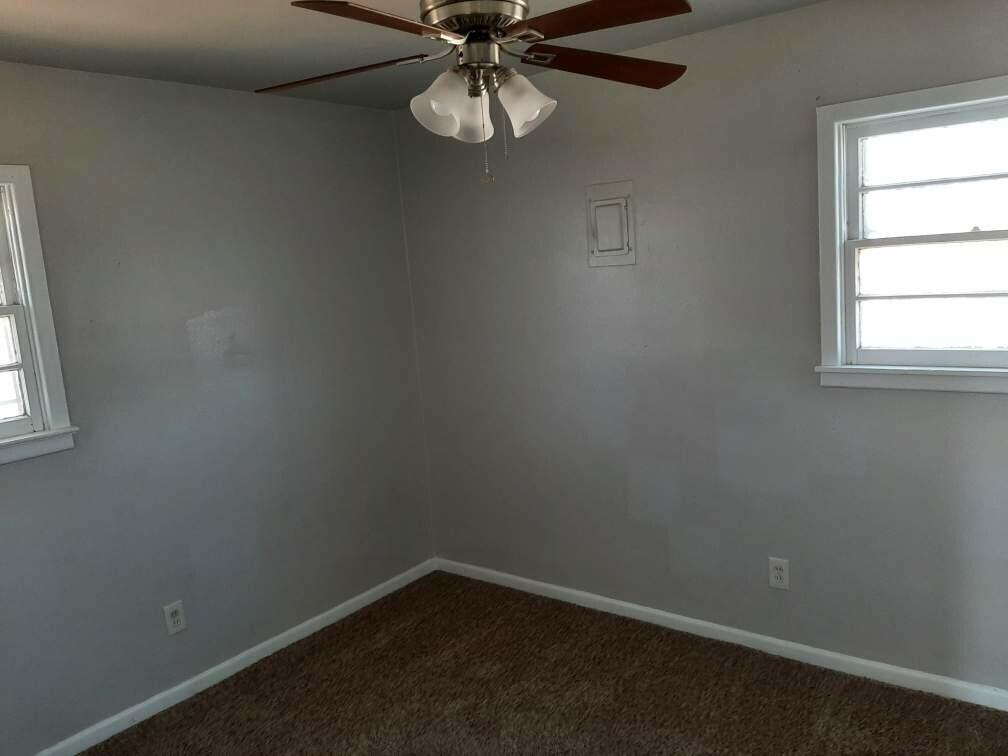 2403 East 5th Street Lubbock, TX 79403 - Photo 4 of 8 an empty room with a window