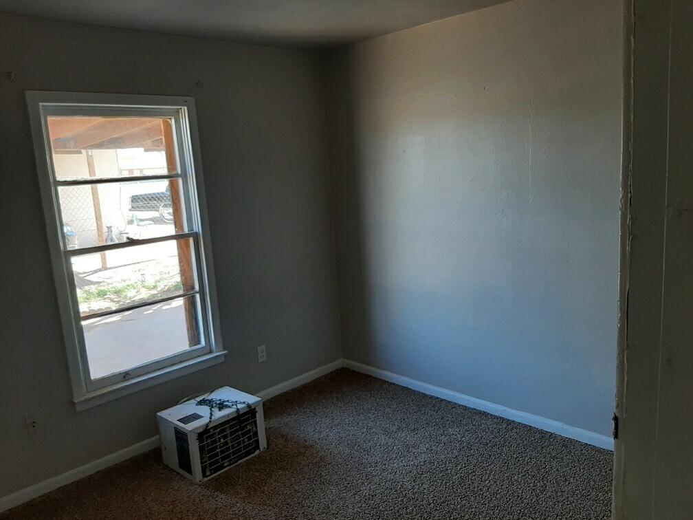 2403 East 5th Street Lubbock, TX 79403 - Photo 8 of 8 an empty room with a window