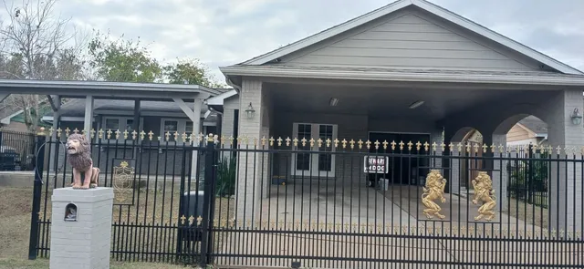 a view of a house with deck and backyard