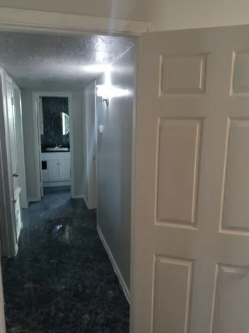a kitchen with wooden cabinets and a sink