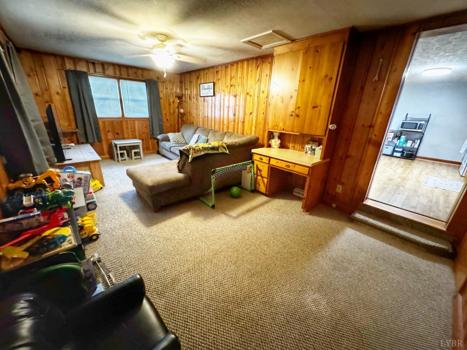 2961 Grit Road Hurt, VA 24563 - Photo 6 of 13 a living room with furniture and a flat screen tv