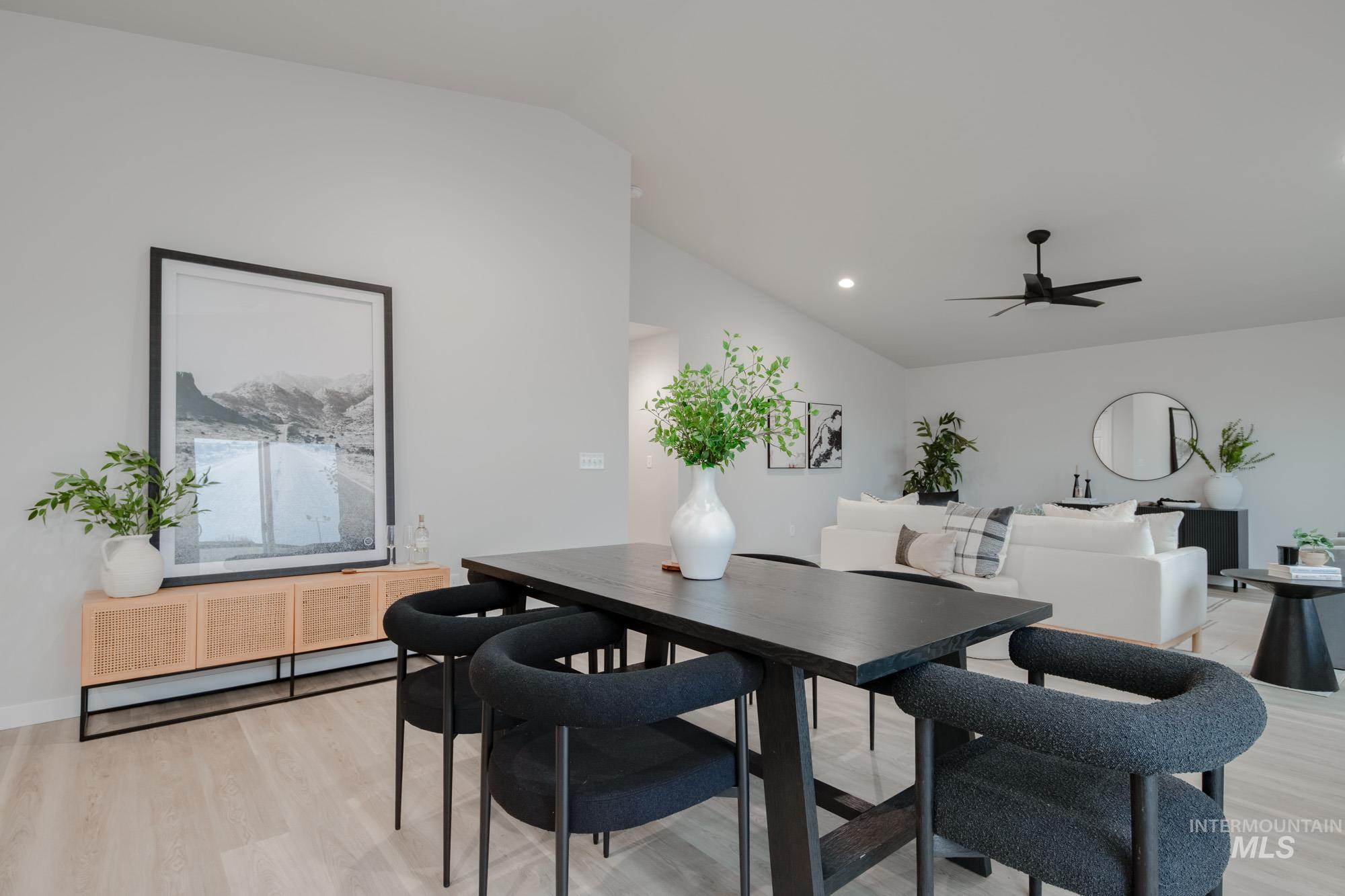 1776 West Unforgettable Street Meridian, ID 83642 - Photo 13 of 28 Dining space featuring vaulted ceiling, light wood-style floors, a ceiling fan, and recessed lighting