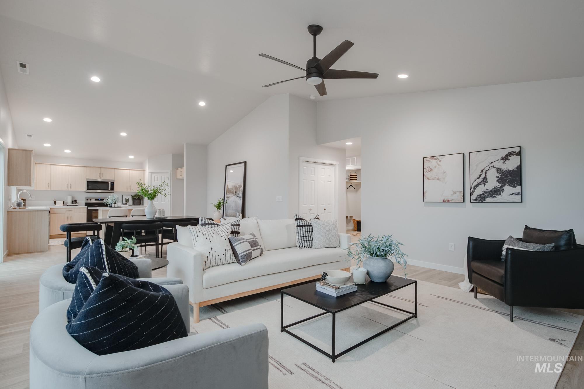 1776 West Unforgettable Street Meridian, ID 83642 - Photo 14 of 28 Living room with recessed lighting, lofted ceiling, light wood-style floors, and ceiling fan