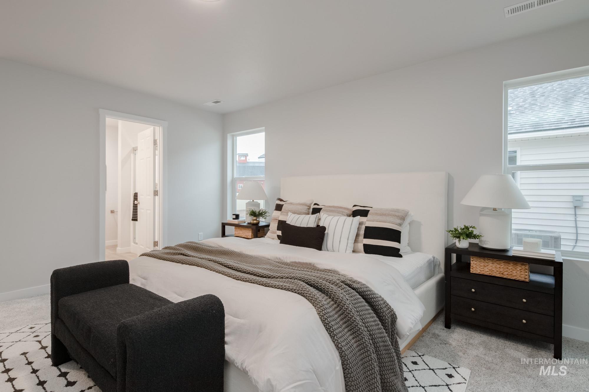 1776 West Unforgettable Street Meridian, ID 83642 - Photo 20 of 28 Bedroom featuring light carpet and ensuite bathroom