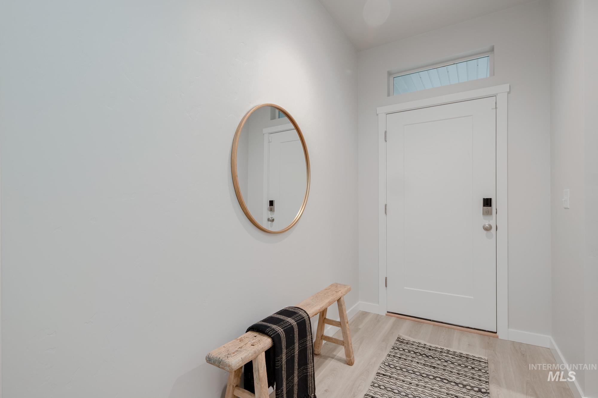 1776 West Unforgettable Street Meridian, ID 83642 - Photo 4 of 28 Entryway featuring wood finished floors and baseboards