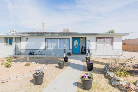 308 West Howell Avenue Ridgecrest, CA 93555 - Photo 2 of 32 a kitchen with a stove and a sink