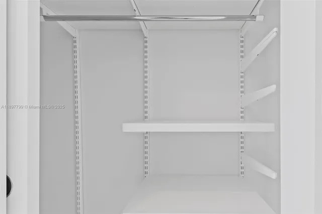 a view of an empty walk in closet