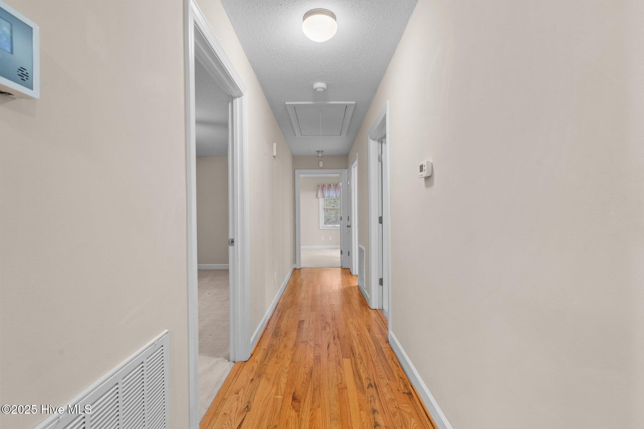 4094 Niagara Carthage Road Whispering Pines, NC 28327 - Photo 38 of 57 Hallway to the bedrooms.